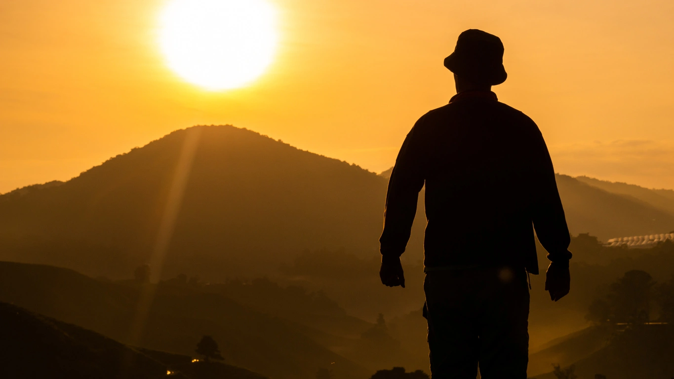 Building America’s future together Veteran standing at sunrise representing hope and purpose